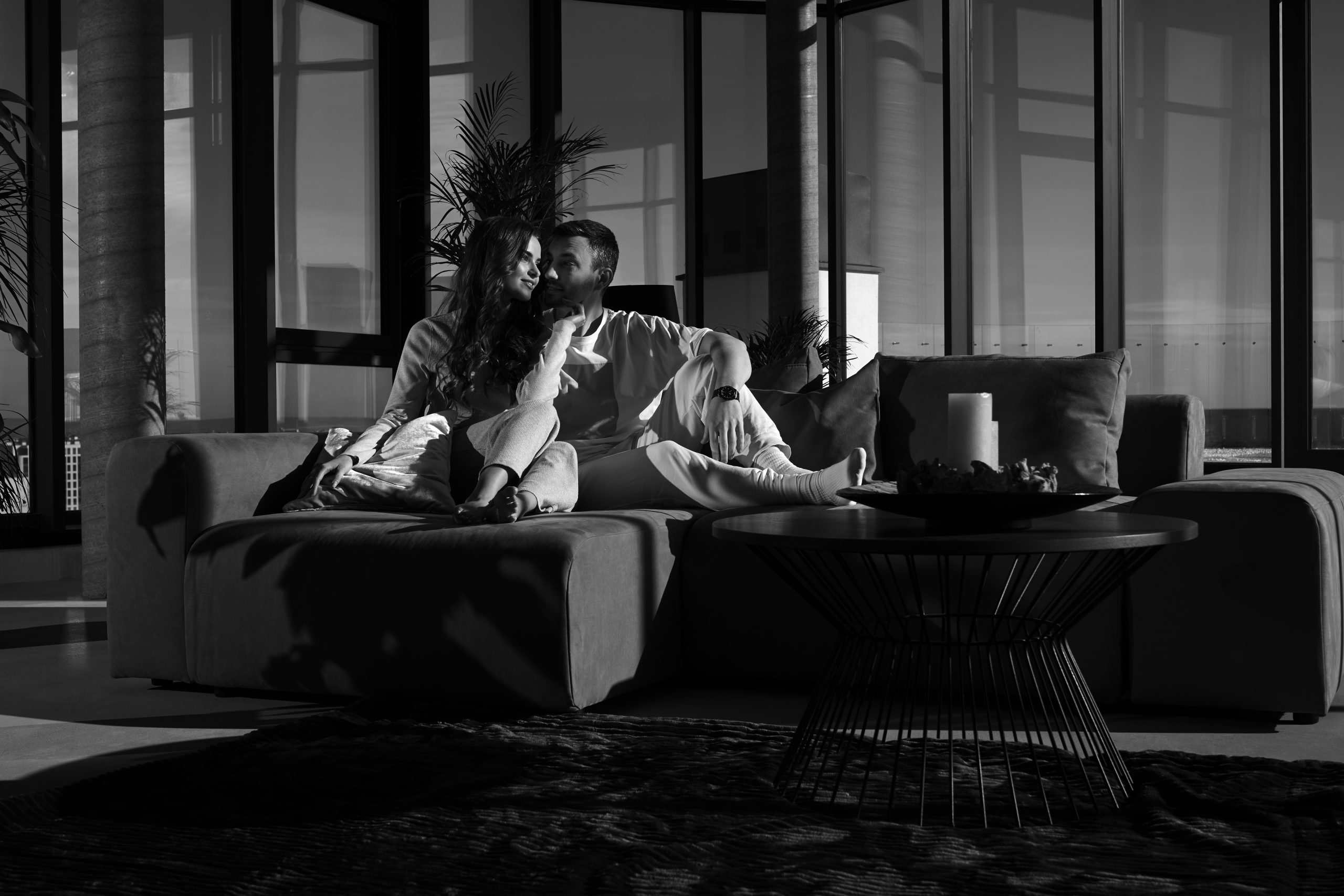 Happy couple resting at home with good mood.